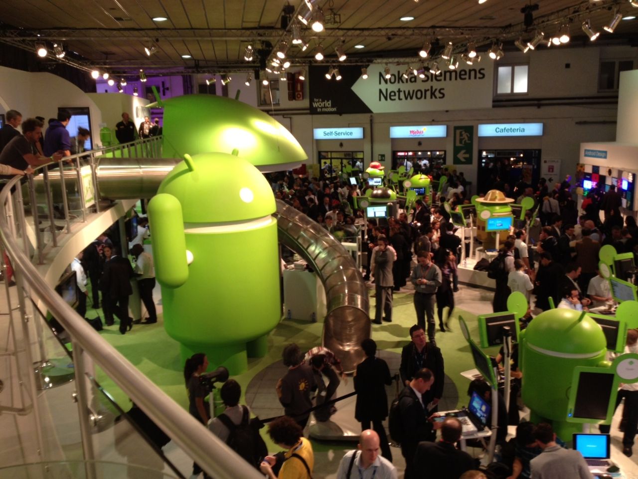 People wander through the Android display area. With no official Apple presence at the Mobile World Congress, Android phones dominate.