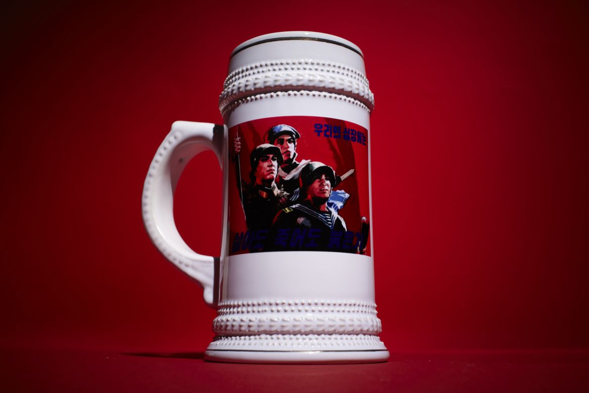 This beer stein declares, "In Life, In Death, Red Is In Our Hearts." 