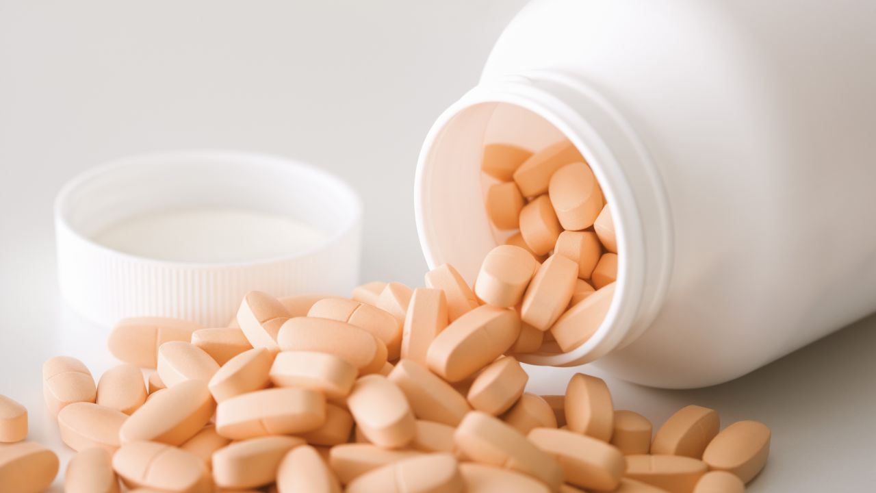vitamins pills spilling bottle