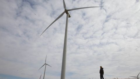 Dean Tofteland checks out a wind turbine in southwestern Minnesota.