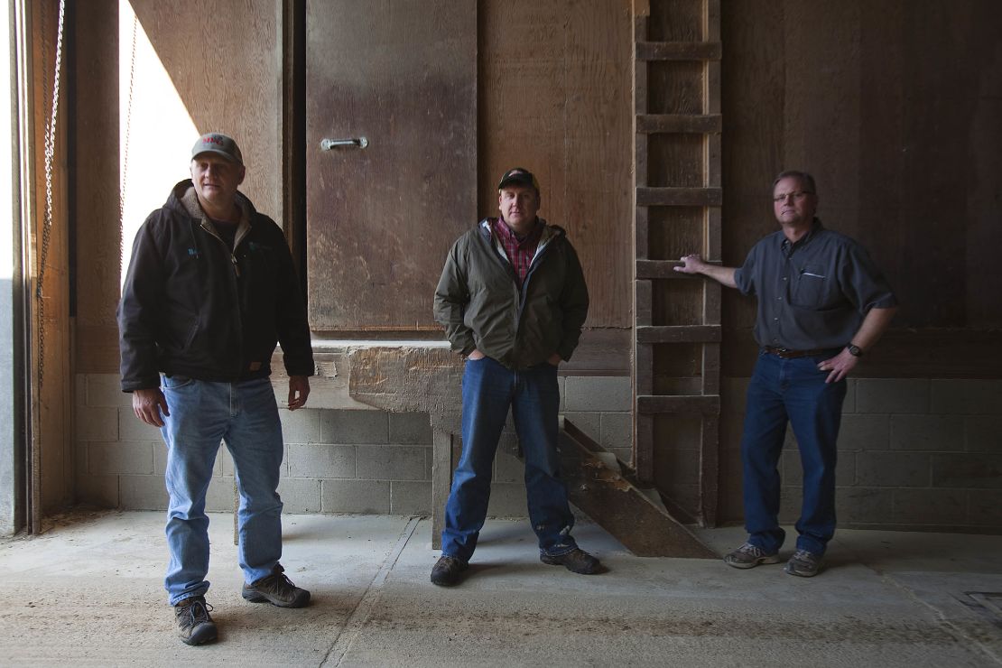 Dean Tofteland, center, with Brad and Mike Mouw at their grain shop in Leota, Minnesota.  