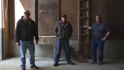 Dean Tofteland, center, with Brad and Mike Mouw at their grain shop in Leota, Minnesota.