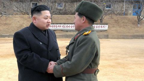 This undated photo shows North Korean leader Kim Jong Un, left, with a senior military officer at an undisclosed location.