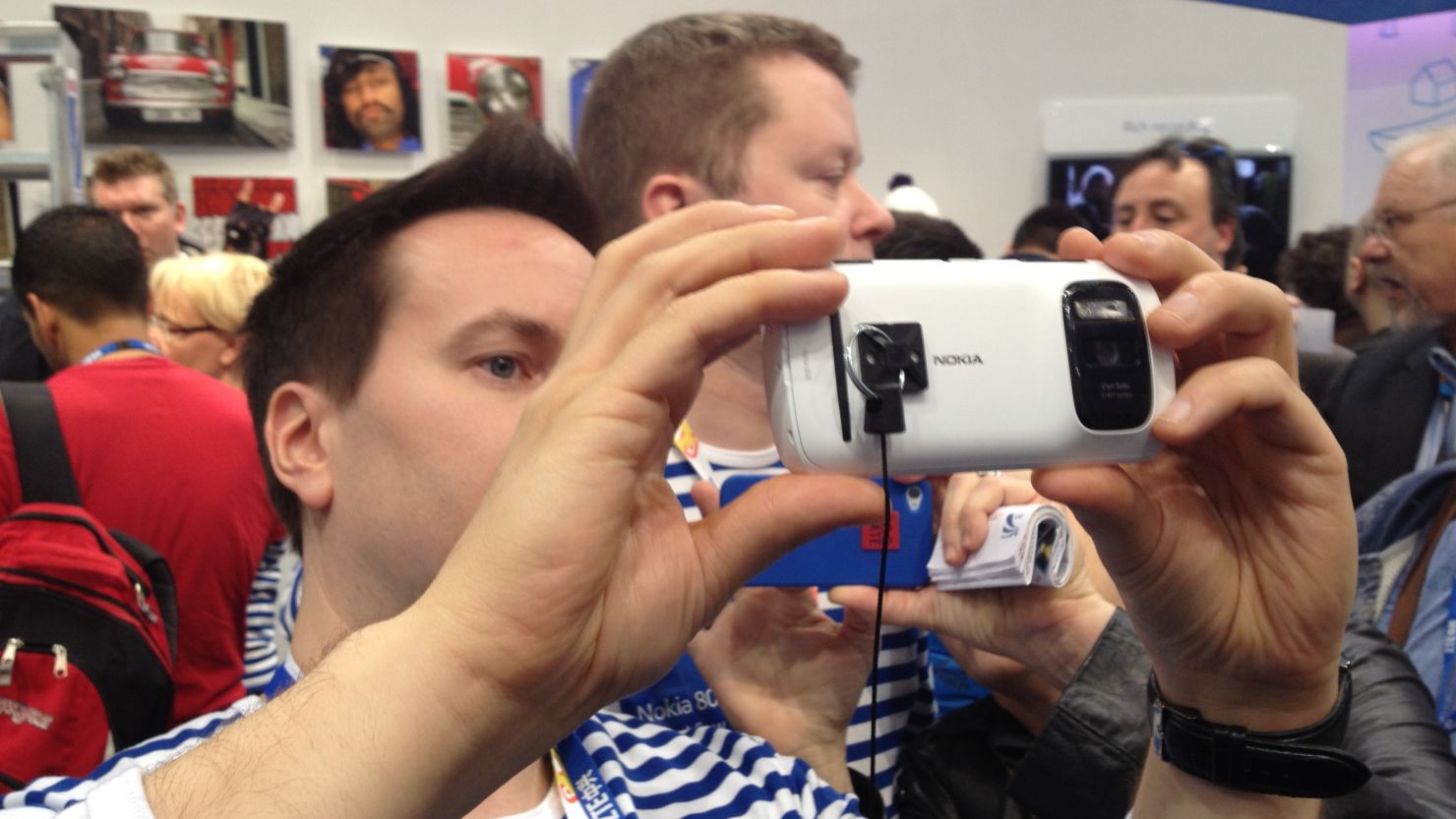 A participant at the Mobile World Congress in Barcelona tries out Nokia's PureView smartphone, February 27, 2012.