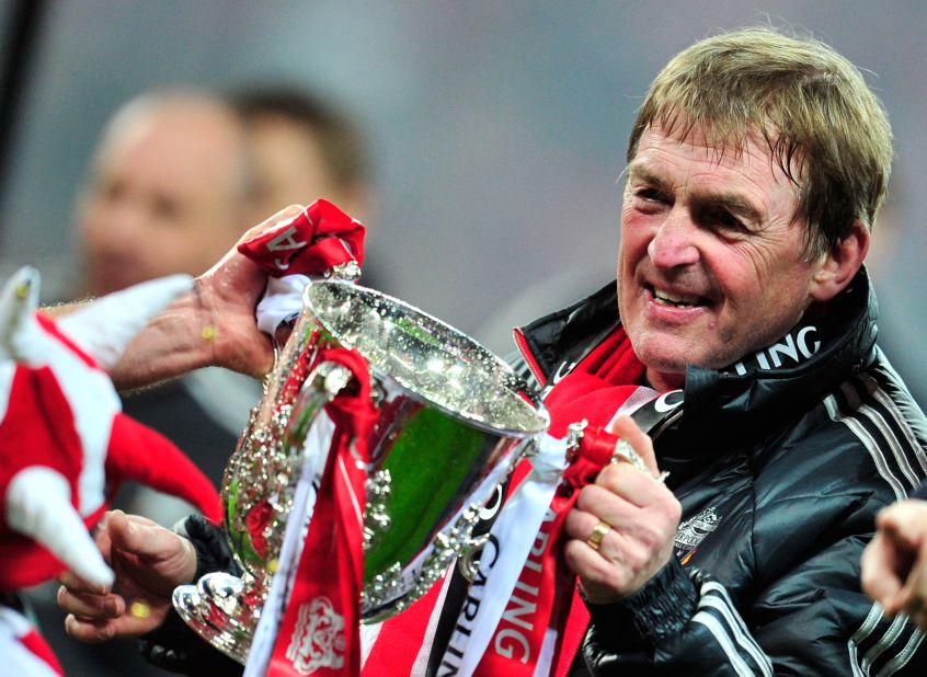 Liverpool manager Kenny Dalglish gets his hands on the English League Cup, the club's first trophy in six seasons. Dalglish's team beat second division Cardiff City in a penalty shootout at Wembley on Sunday.