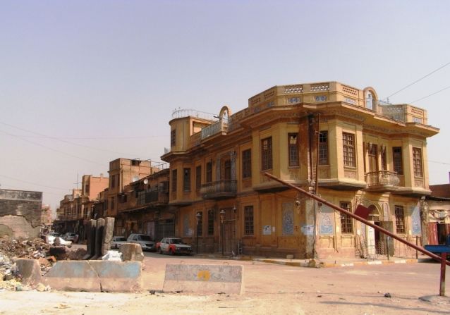 A typical 1930s house in the Rusafa district of Baghdad, with concrete blocks used to divide neighborhoods with the aim of reducing sectarian violence. Photo taken in 2011.