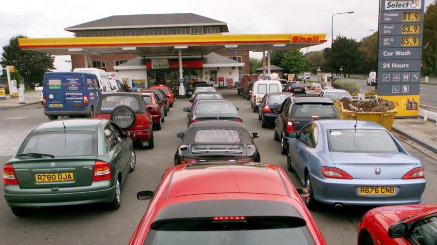 Protests over high gas taxes shut down oil refineries and depots, and left drivers stranded for hours in lines across England in September 2000. Here, cars queue for petrol at a Shell service station in Manchester on September 14, 2000.