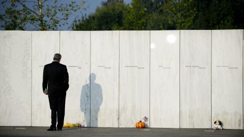 A visitor walks along the Wall of Names during the ceremony marking the 10th anniversary of the crash of United Flight 93 at the Flight 93 National Memorial on September 11, 2011 in Shanksville, Pennsylvania. An estimated crowd of 5,000 watched as the memorial wall was unveiled with the names of the 40 passengers who died when the plane crashed during the terrorist attacks on September 11, 2001. 