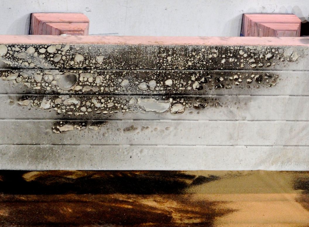This safety barrier shows the impact of the flames which engulfed a section of the track.