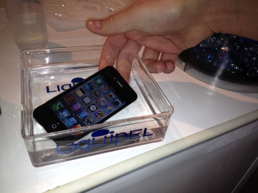 An iPhone waterproofed using a substance called Liquipel is submerged at the 2012 Mobile World Congress in Barcelona, Spain. 