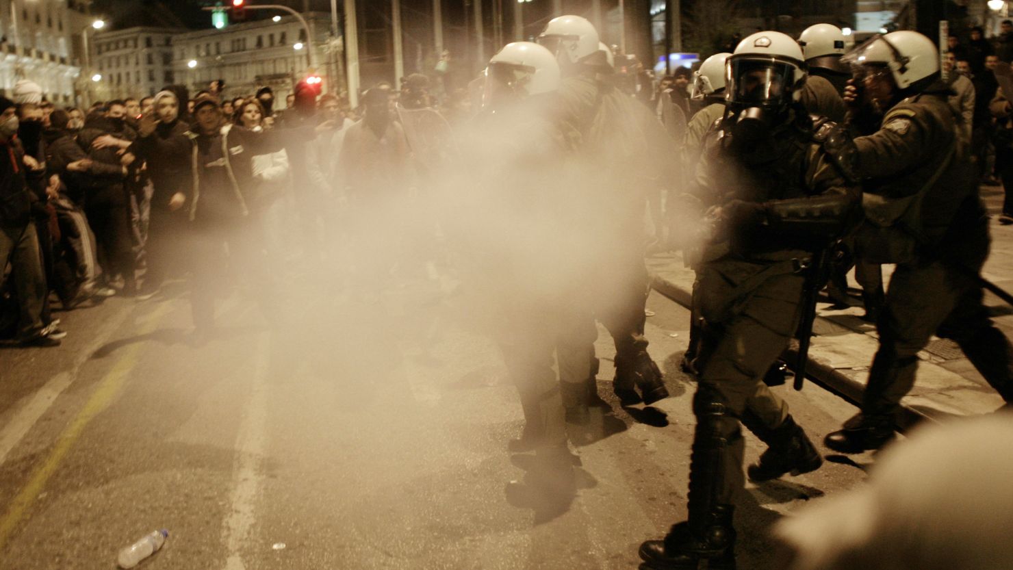 Riot police spray tear gas during a protest against austerity measures on February 19, 2012 in Athens.