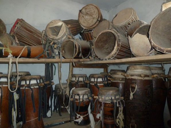 Hand made sabar drums fill a storage space in one of Doudou N'Diaye Rose's homes.