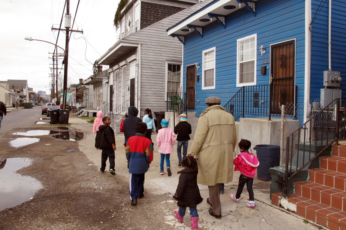 Darryl Durham, head of Anna's Arts for Kids, walks with several children through the Treme neighborhood.