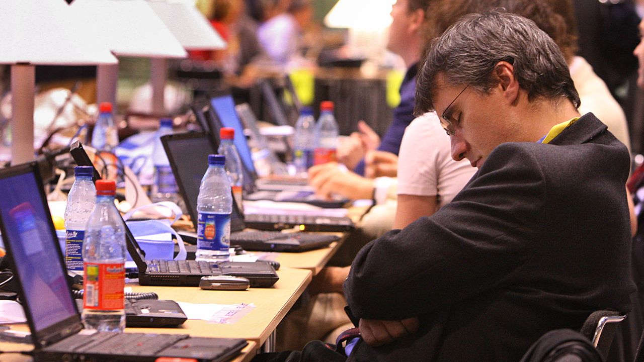 A man sleeps at a European Council meeting in Brussels, Belgium.