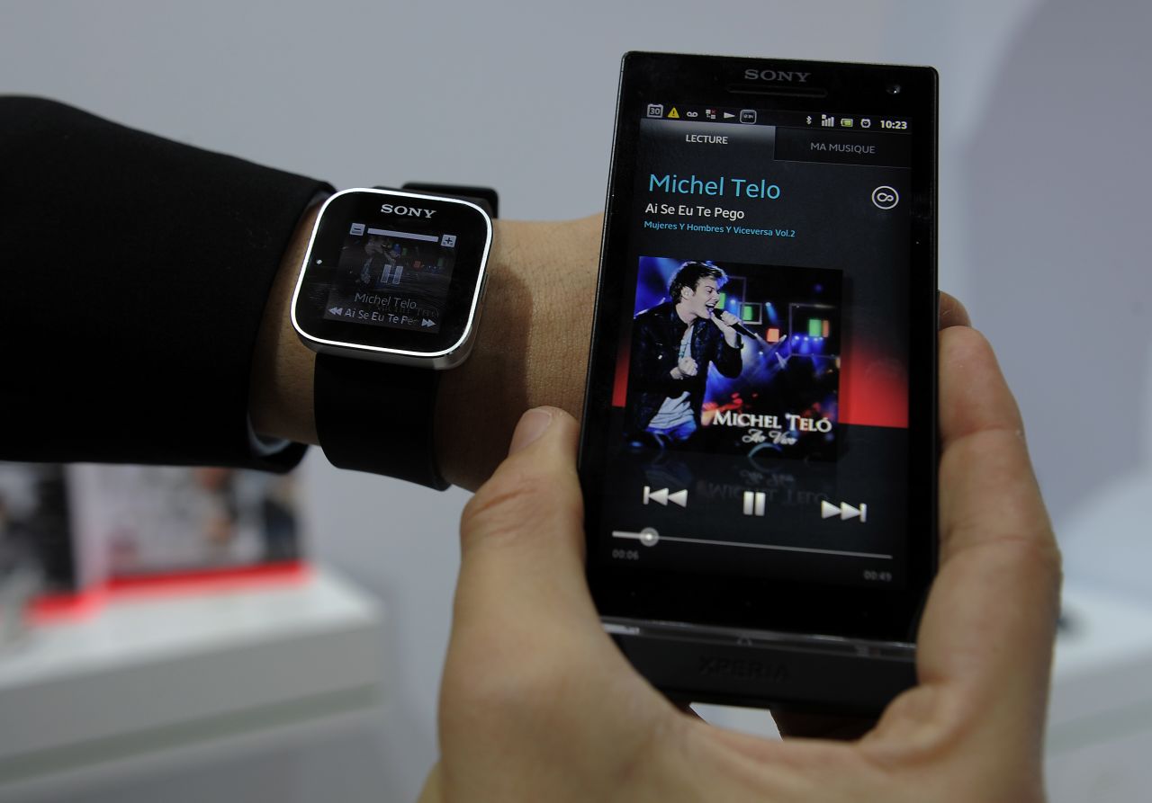 A man displays a Sony SmartWatch conected to a Sony mobile phone during a presentation at the Mobile World Congress on February 28