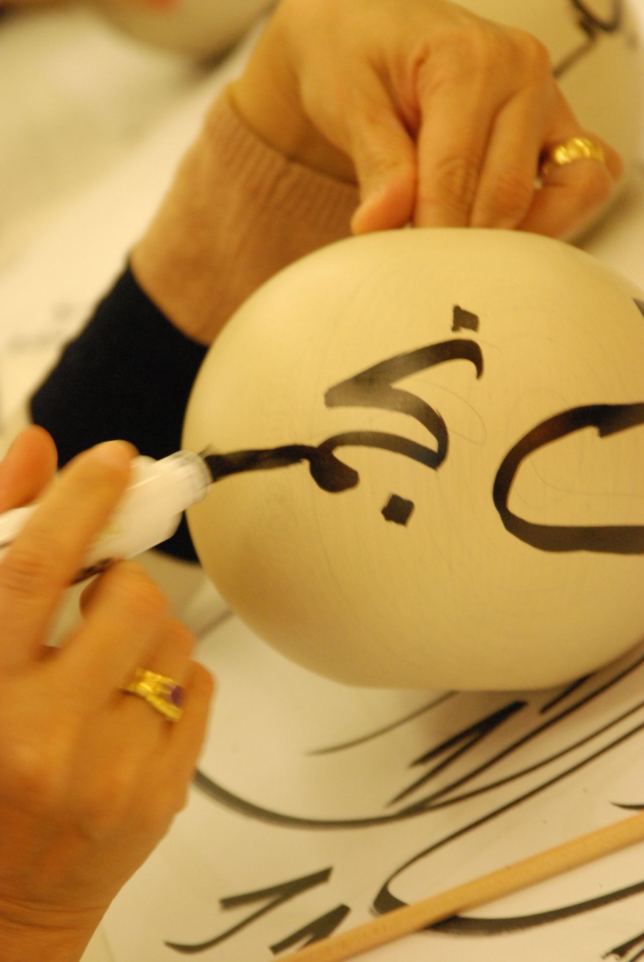 Three hundred women at sessions around Saudi Arabia wrote their names on maplewood balls for Al-Dowayan's "Esmi (My Name)," which challenges the Saudi taboo that prevents men from saying the names of women in their lives.