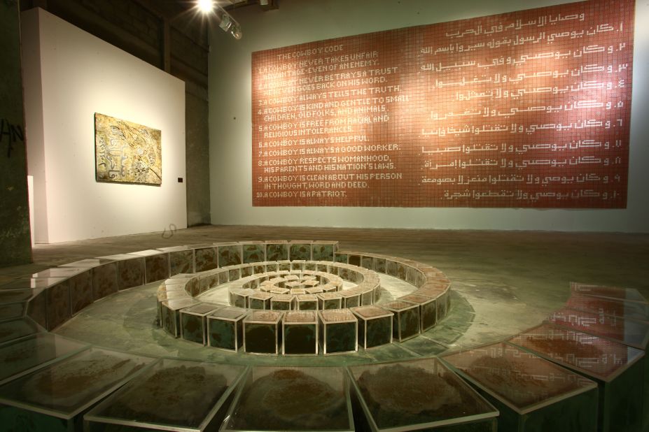 On show at Edge of Arabia (on the back wall), the artwork is made from 3,000 plastic cap gun discs. Mater says people in Saudi are afraid to talk, but adds that freer expression should come as part of a gradual change. 