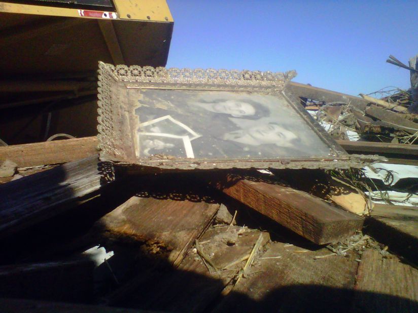 An old family photo survives the destruction in Buffalo, Missouri.