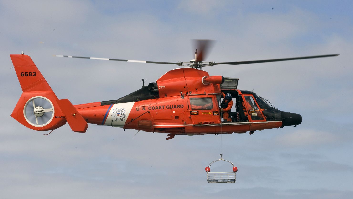 A Coast Guard MH-65 Dolphin is shown during training in May 2011.  An MH-65 crashed Tuesday night off the coast of Alabama.