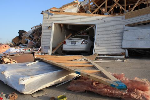 A Harrisburg neighborhood lies in ruins Thursday after a  tornado tore through the town. A monster storm system killed six people in Harrisburg and left at least seven others dead in two other states.