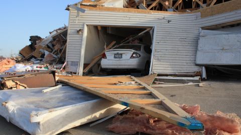 A Harrisburg neighborhood lies in ruins Thursday after a tornado tore through the town. A monster storm system killed six people in Harrisburg and left at least seven others dead in two other states.