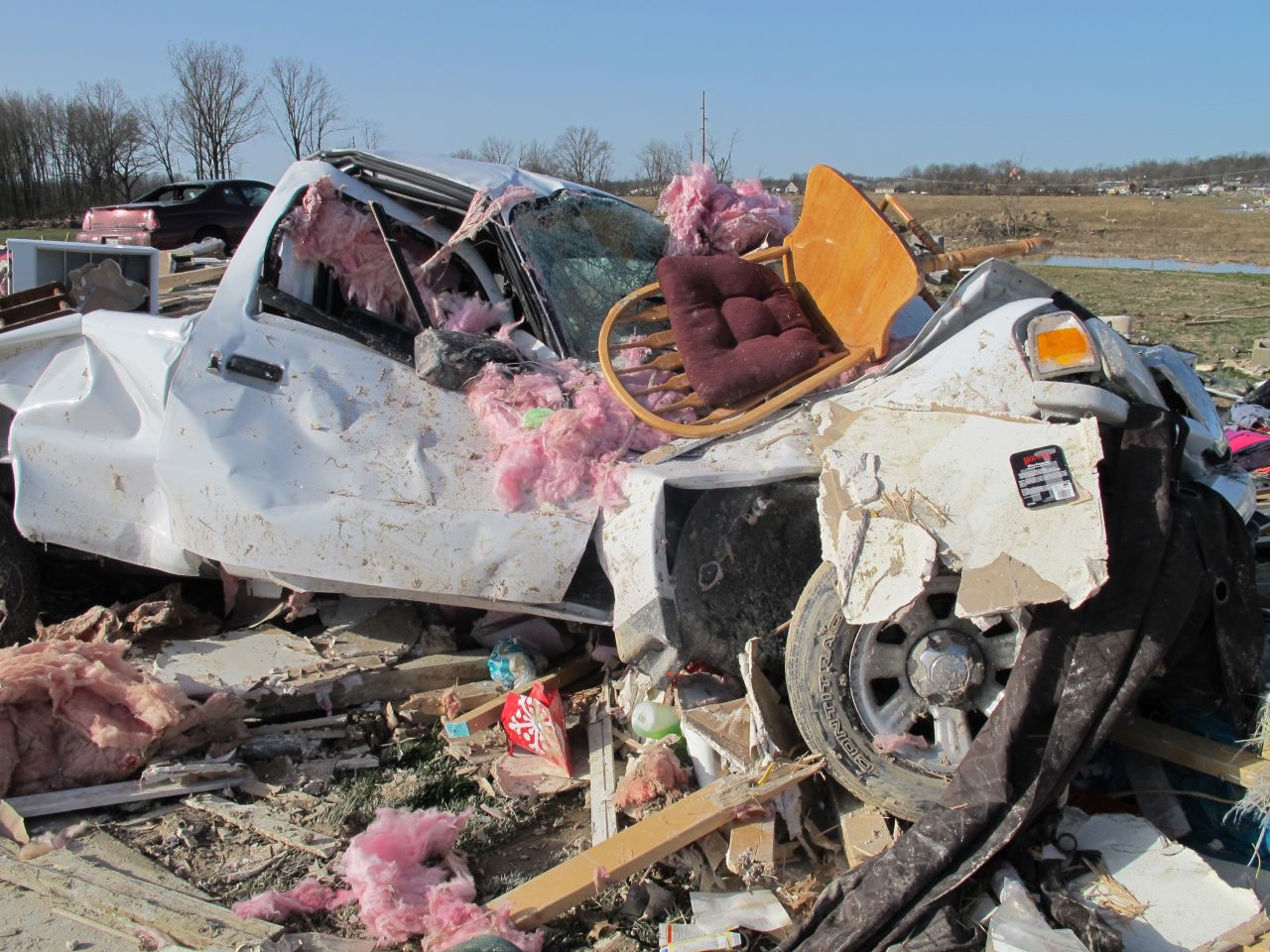 A truck appears twisted like a toy Thursday in the storm's aftermath in Harrisburg. A tornado with winds up to 180 mph thrashed the southern Illinois town early Wednesday.