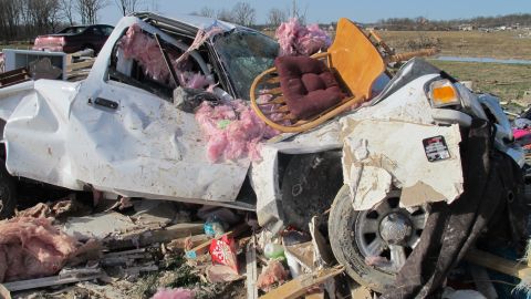 A truck appears twisted like a toy Thursday in the storm's aftermath in Harrisburg. A tornado with winds up to 180 mph thrashed the southern Illinois town early Wednesday.