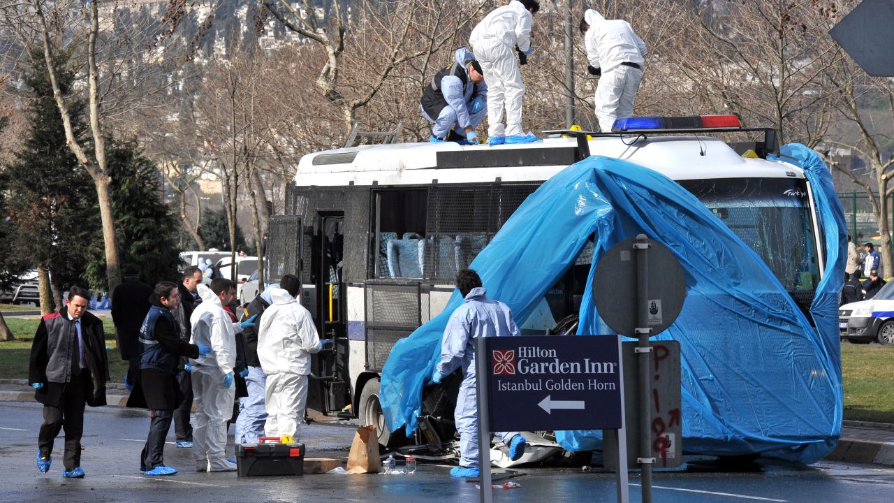 Turkish forensic police search a police bus after an explosion in Istanbul, on March 1, 2012.