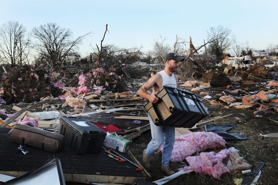 Josh Summers searches for his possessions after the tornado ripped through his Harrisburg neighborhood. The twister appeared to have been on the ground for several miles, a city official said.
