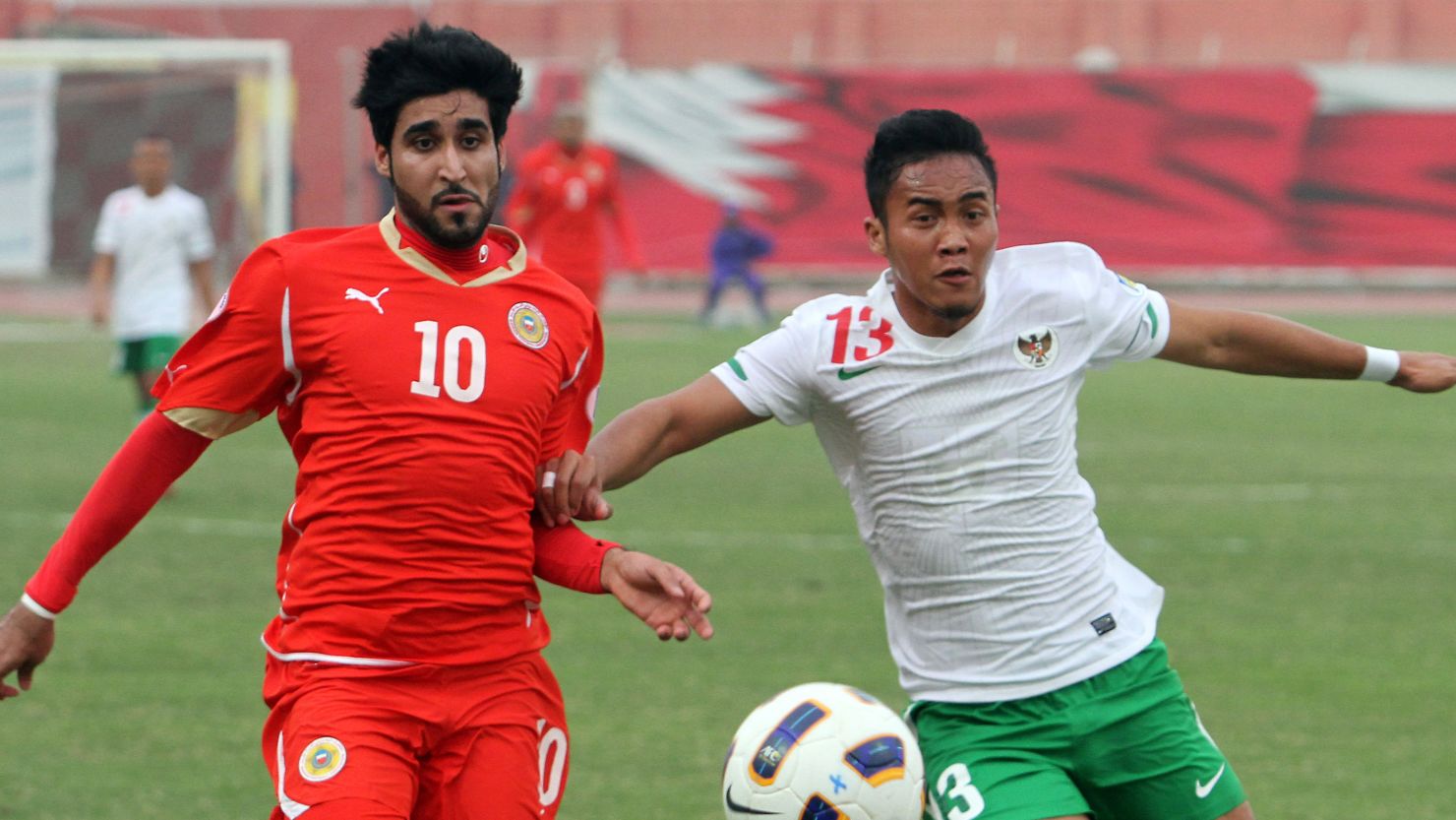 Bahrain's Mohammed Ali (left) battles for the ball with Indonesia's Guvan Dwicahyo during Wednesday's match.