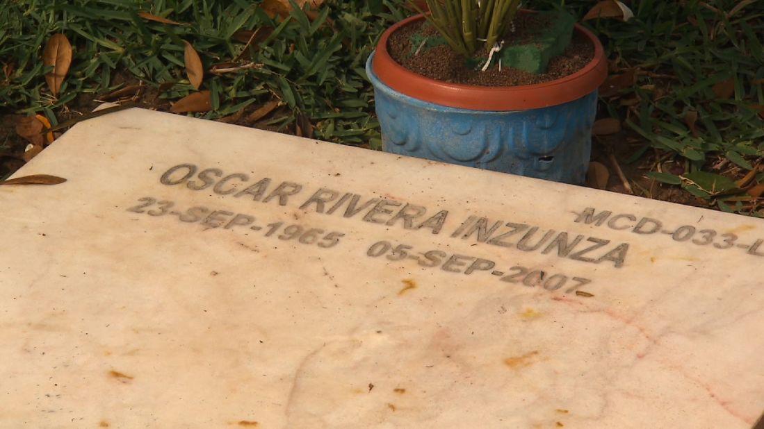 In stark contrast to the Jardines del Humaya, a stark headstone sits in a small cemetery a few miles away. Oscar Rivera, a journalist, was shot down in 2007.