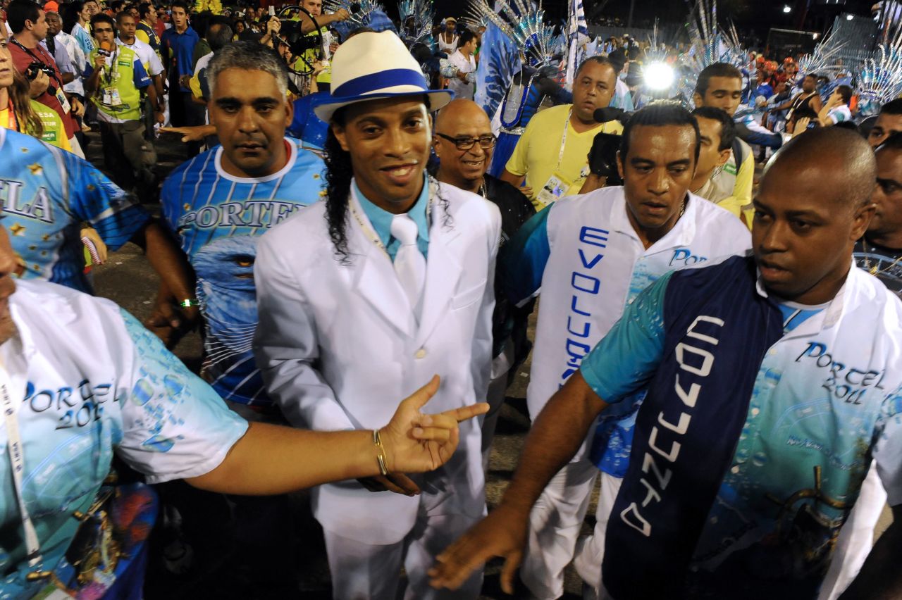 Like Neymar, Ronaldinho also enjoys letting loose during the carnival. He is pictured here dancing with a samba school in Rio during the 2011 carnival.