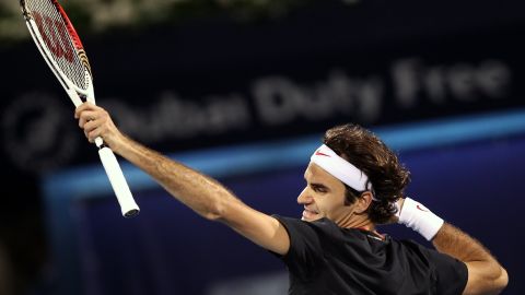 Roger Federer punches the air after beating Scotland's Andy Murray in the final of the Dubai Open on Saturday