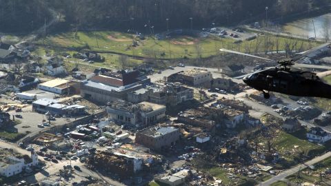 A helicopter carrying Kentucky Gov. Steve Beshear flies over the battered town of West Liberty.