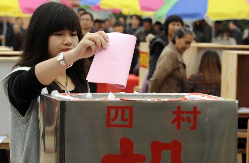 Xue Jianwan, the daughter of a local leader who died during last year's unrest, votes in Wukan village elections Saturday.