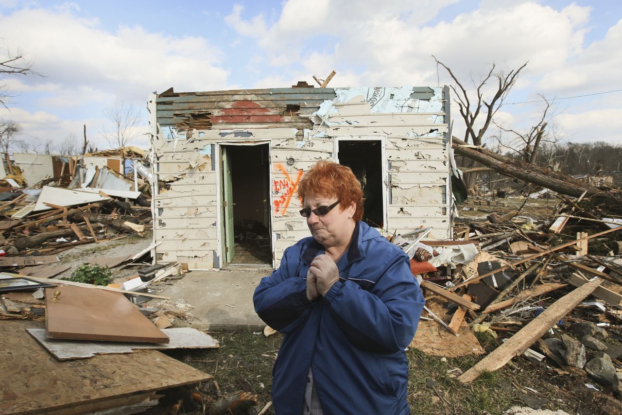 Janet Clark stands in front of her home on Sunday, March 4, where she rode out Friday's EF4 tornado in Henryville, Indiana. 