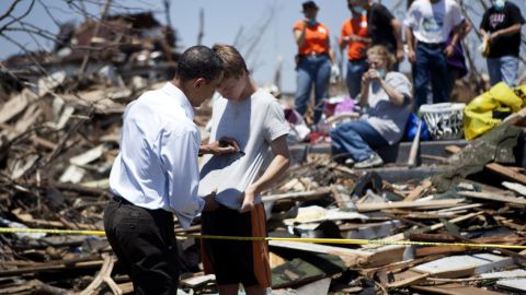 President Obama signs a youth's shirt during a May 2011 visit to tornado-ravaged Joplin, Missouri.