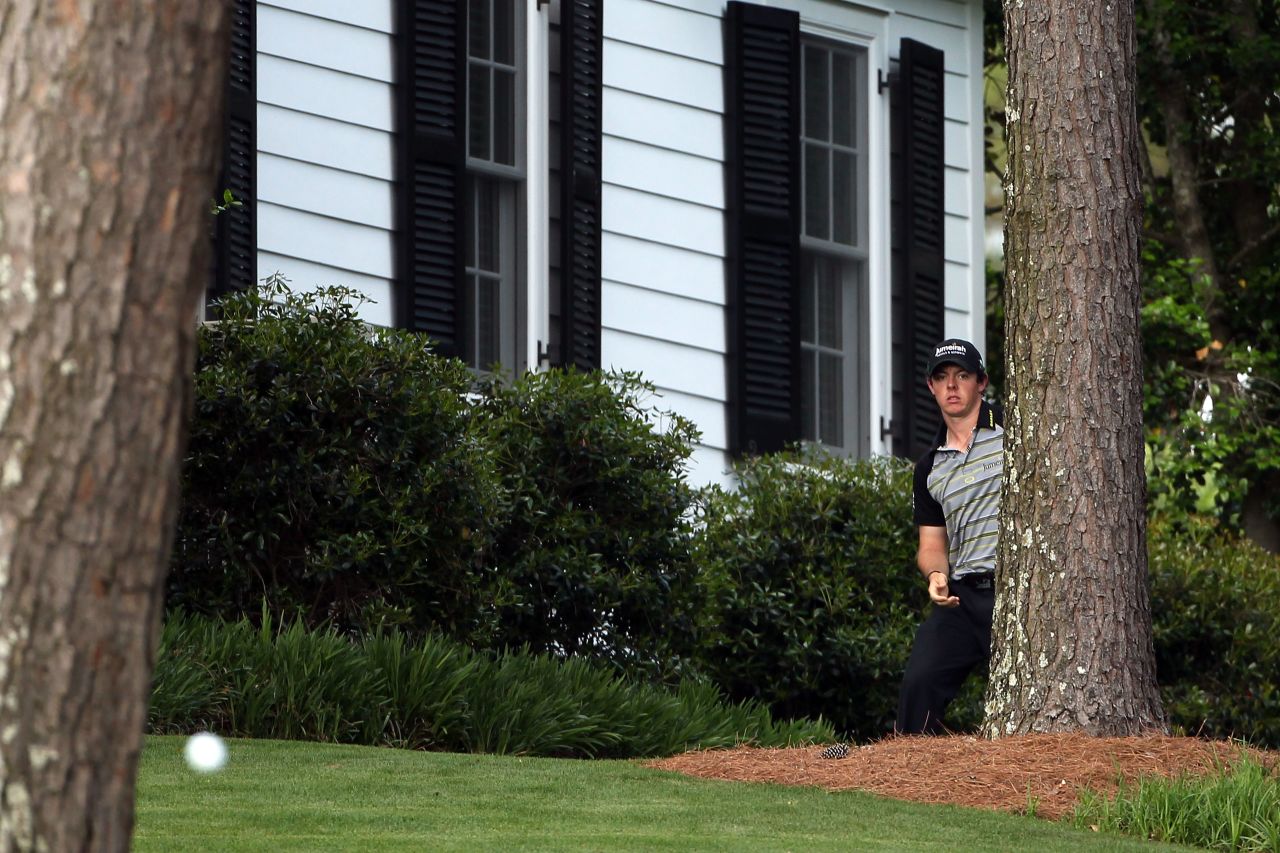 <a href="http://edition.cnn.com/2011/SPORT/golf/04/10/golf.masters.schwartzel.woods/index.html">Masters disaster</a>. McIlroy chips out from the trees on the 10th hole during the final round of the 2011 Masters at Augusta National Golf Club. He sqaundered a four-shot lead in the final round to eventually finish in a tie for 15th.  