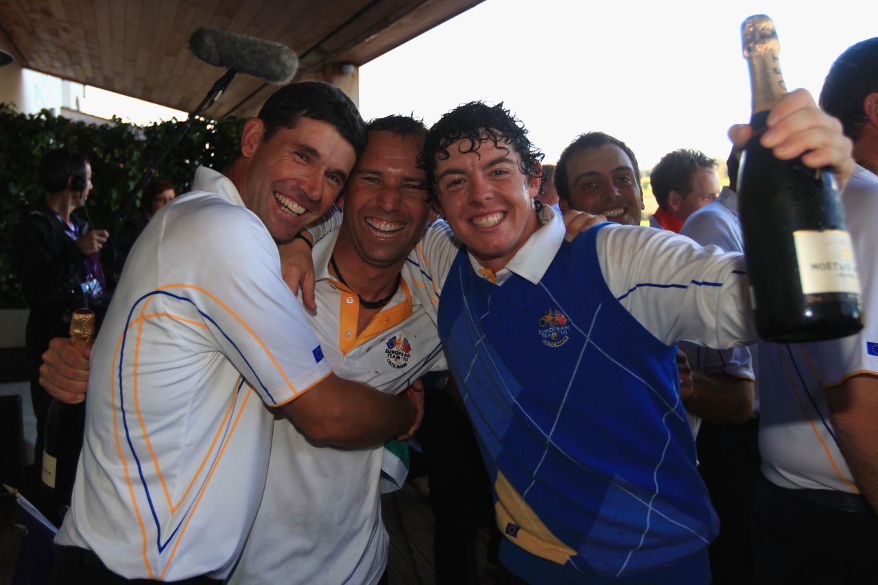 McIlroy celebrates Europe's win (by one point) over the U.S. team with teammate Padraig Harrington (left) and vice-captain, Spain's Sergio Garcia. 