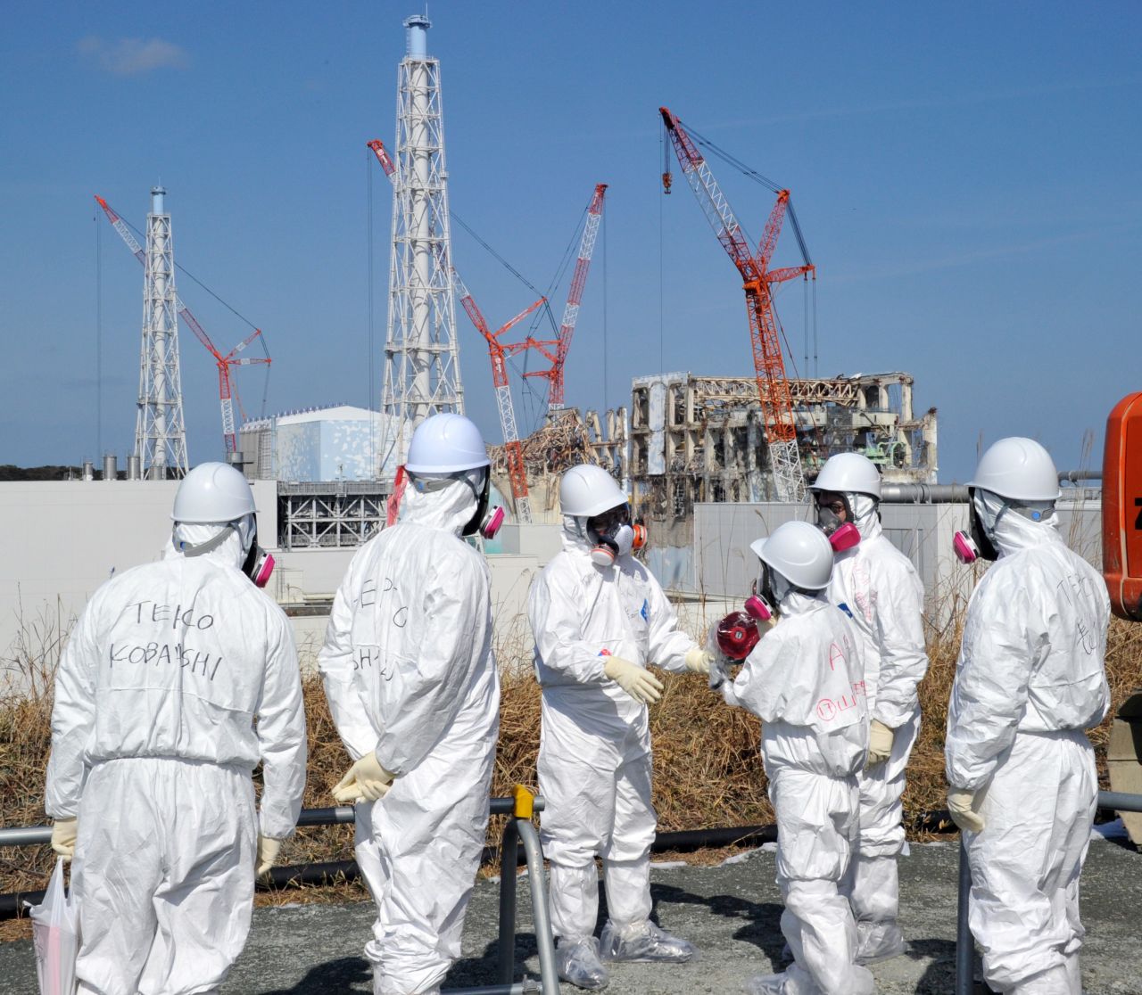 A Tokyo Electric Power Co. worker describes the situation a year after the disaster at Fukushima to journalists on February 28. 