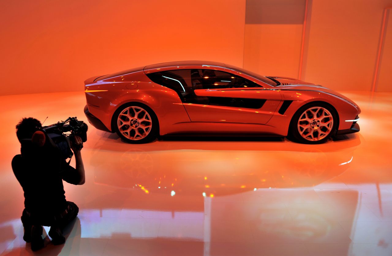 The hybrid-electric Giugiaro Brivido concept car is photographed by journalists ahead of the Geneva Car Show.