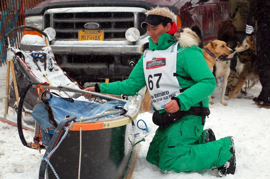 A musher preps his sled in Anchorage Saturday.
