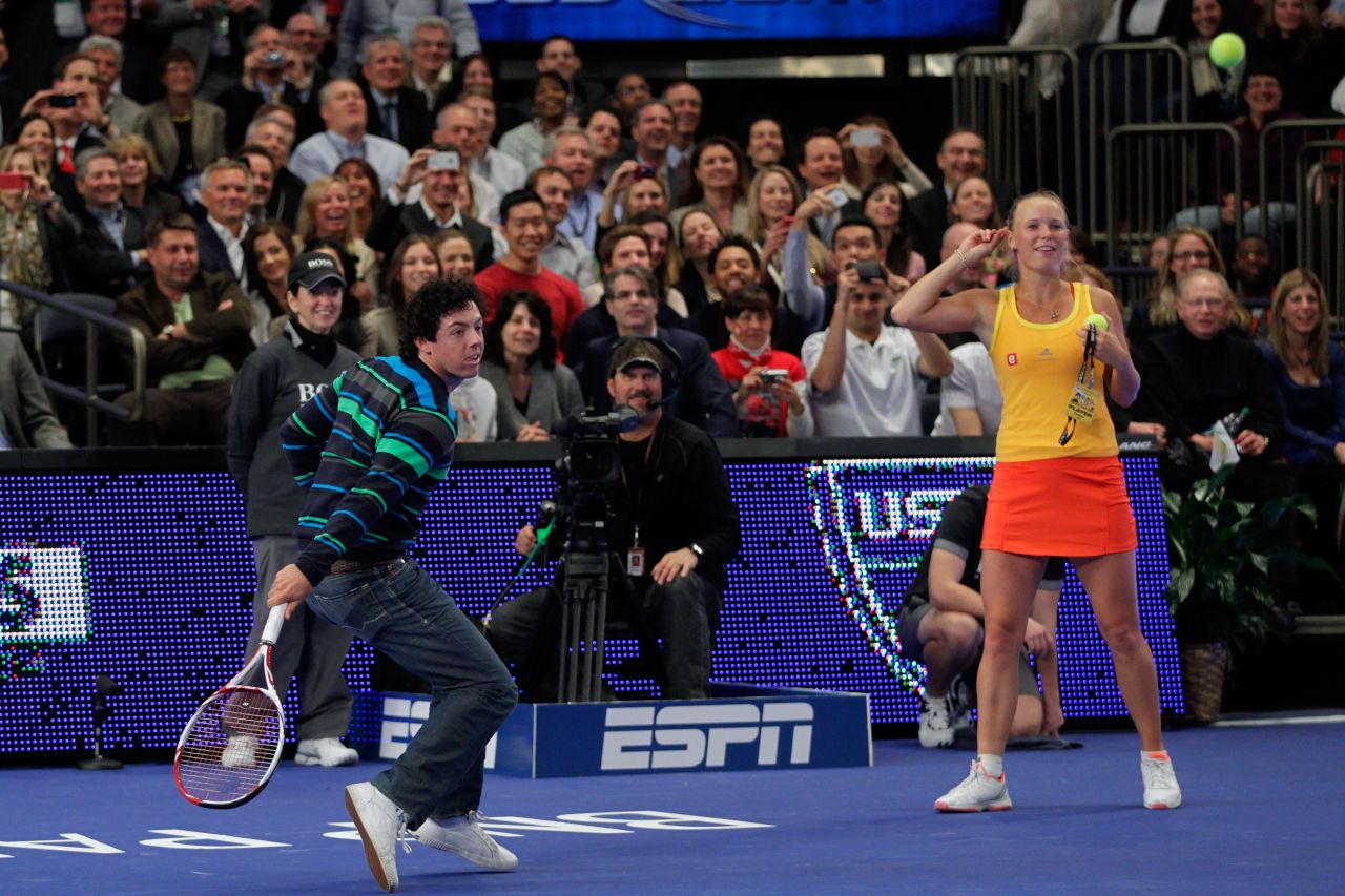 Golf ace Rory McIlroy shows he is a dab hand at tennis with a backhand return against Maria Sharapova.