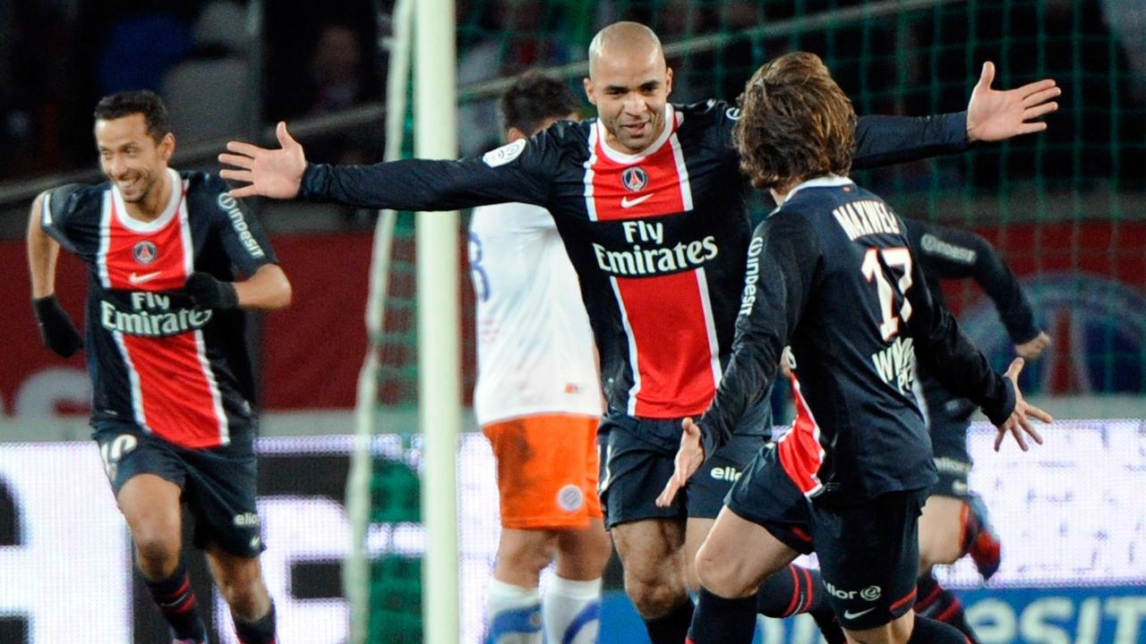 Paris Saint-Germain's Alex Rodrigo Dias Da Costa (C) celebrates with teammates after scoring a goal.
