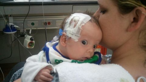 Haleigh Jacobs cuddles her 2-month-old son, Brantley, who has severe medical problems.