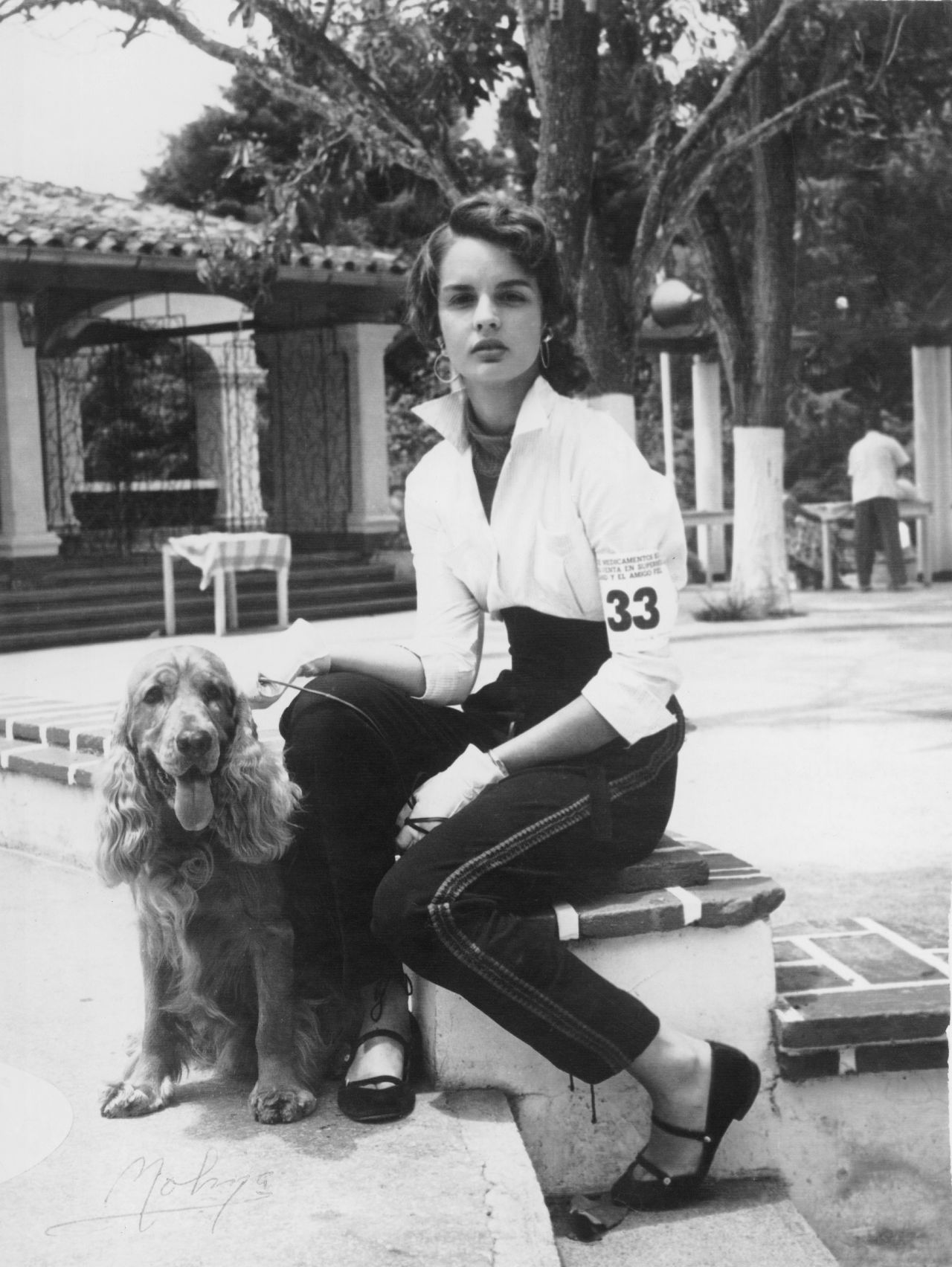 Carolina Herrera, aged 16, with her cocker spaniel, Red, at a dog show in Caracas, Venezuela. She says she was more interested in horses than fashion as a child, but was always surrounded by beautifully dressed women.