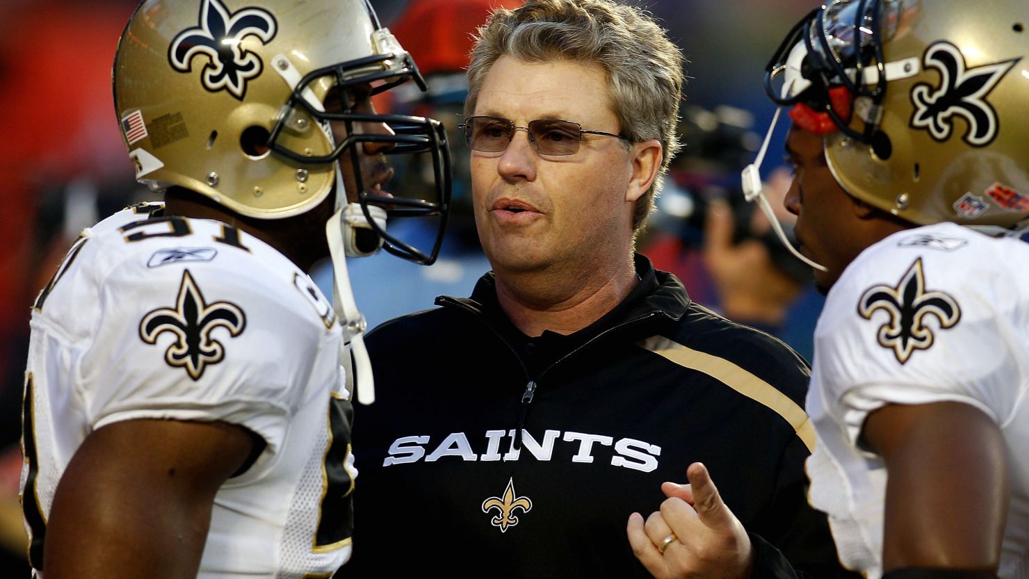 Former New Orleans Saints Defensive Coordinator Gregg Williams talks with players during Super Bowl XLIV.