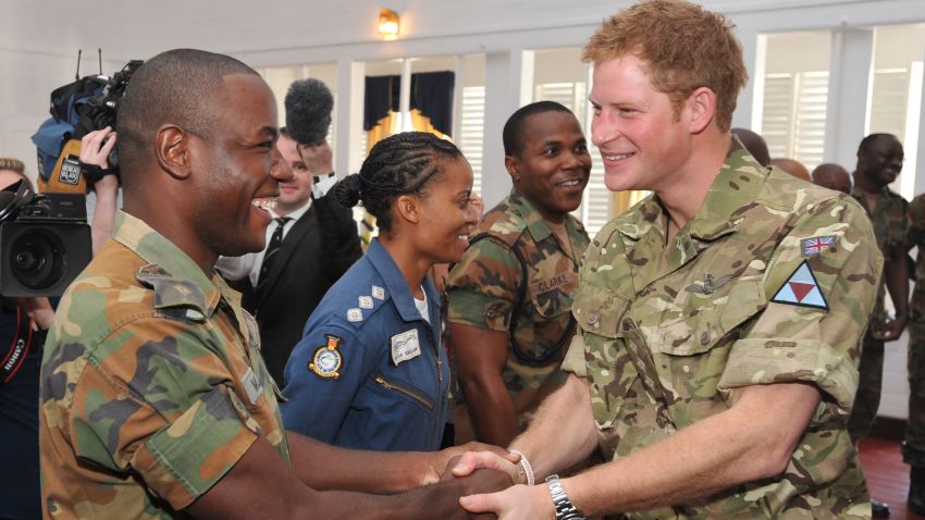 Prince Harry meets a fellow Sandhurst trainee cadet during his visit to the Up-Park Camp on March 7 in Kingston, Jamaica.