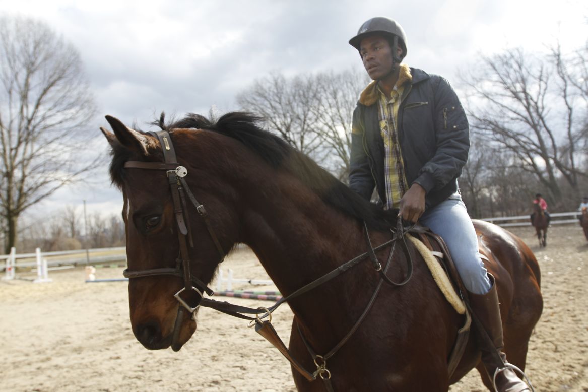 Rhyheem Cauley works out his horse on a recent blustery Saturday afternoon. Cauley, 19, used to visit the Chamounix Equestrian Center to watch the horses when he was younger. He spent five years in the program.  