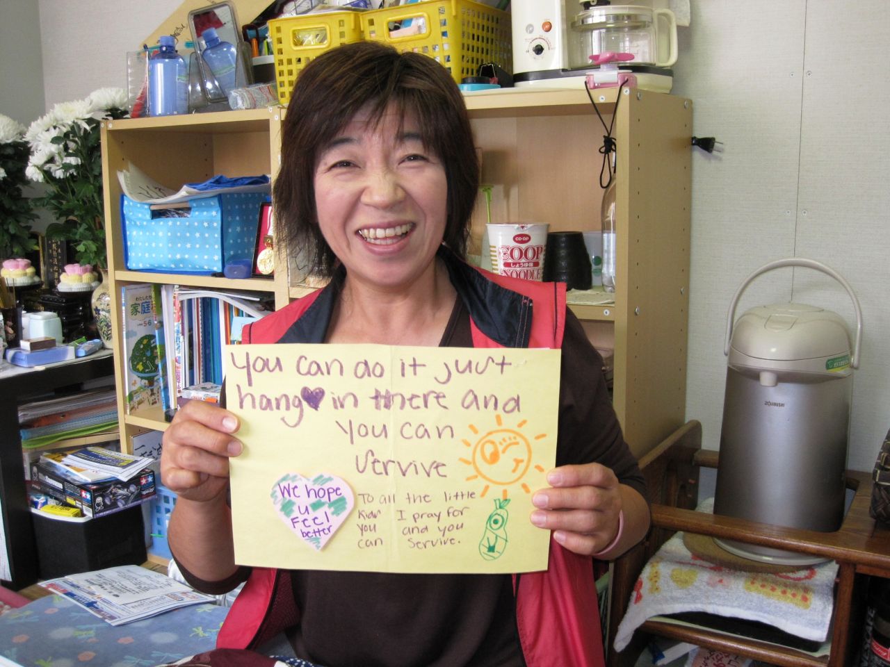A woman in the small village of Ogatsu, Japan, is encouraged by the notes and letters sent from the United States.